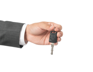 Hand holds car key, offering it. Sleeve and shirt visible