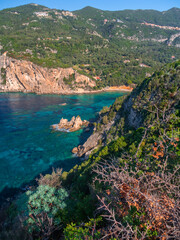 Panoramic view of the resort town of Paleokastritsa, sea and the cliffs of the Ionian Sea in Corfu, Greece