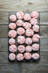 Homemade Strawberry and Red Velvet Crinkle Cookies on Cooling Rack. 