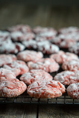Homemade Strawberry and Red Velvet Crinkle Cookies on Cooling Rack. 