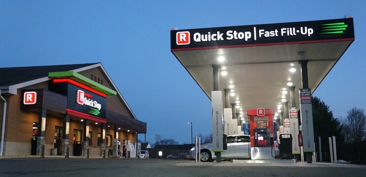 Bally, Pennsylvania, U.S.A - Dec 24, 2025 - Redner&rsquo;s Quick Stop offers fuel and convenience store services with self-service pumps and illuminated signage.