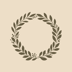 A simple, elegant circular wreath made of olive leaves and berries, on a light beige background.