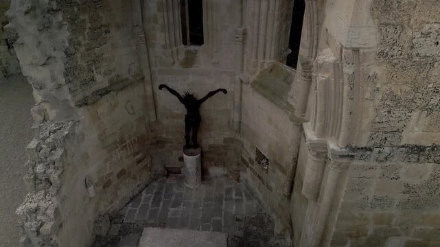 Sculpture of Jesus on the cross in the ruins of the church of San Anton.