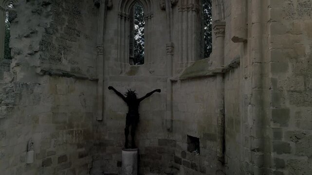 Sculpture of Jesus on the cross in the ruins of the church of San Anton.
