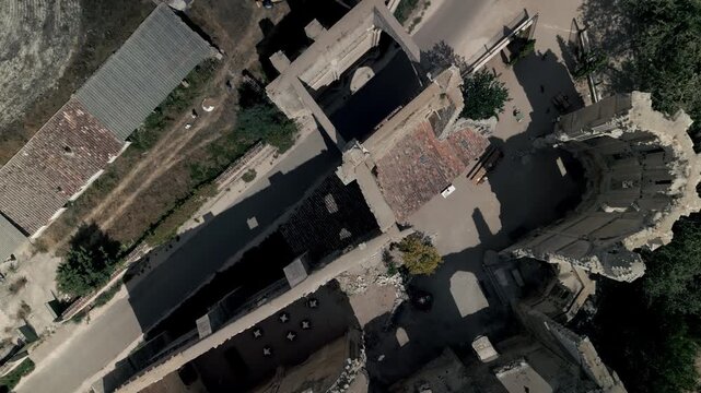 Vertical drone panorama of the ruins of the medieval San Anton church on the Camino de Santiago pilgrimage route.