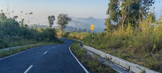 Cinematic road view in tropical hills