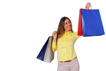 Happy young woman enjoying retail therapy, smiling and holding colorful shopping bags, feeling successful after good sales