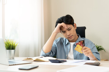 Stressed bankrupt financial crisis concept, Young adult in nervous after calculated loan expense...