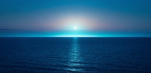 Horizon where the ocean meets the sky during a serene twilight with a glowing orb of light