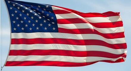 Obraz premium United states flag waving proudly in the wind against blue sky