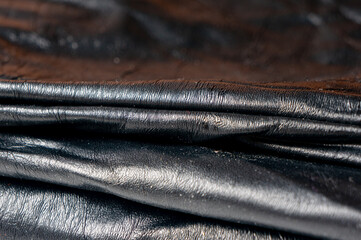 Thin soft black leather close-up