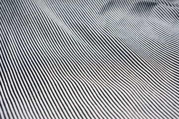 Close-up of thin cotton fabric with black and white stripes