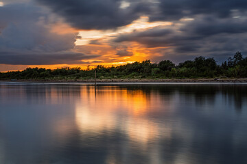 Obraz premium a sunny summer sunset over the Bibione Pineda lagoon, Bibione, san michele al tagliamento, Venice