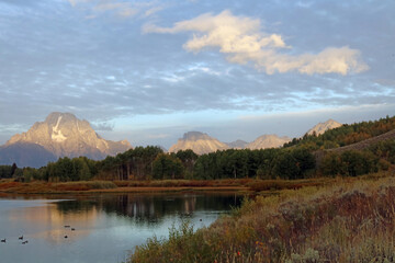 Early morning sunlight touching the tops of the Tetons, Grand Teton National Park, Wyoming  USA
