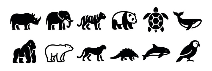 Obraz premium Set of twelve black wild animal icons including a rhino, elephant, tiger, panda, turtle, whale, and gorilla in a simple graphic silhouette style for wildlife conservation concepts