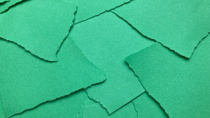 green pieces of torn paper with ripped edges. torn green pieces. Green background from green pieces. Ripped green paper mockup isolated