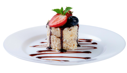 Square dessert topped with berries and mint, drizzled sauce