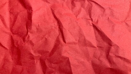 textured surface crumpled red paper. wrinkled paper texture background, Red recycled paper texture. Bright red crumpled paper background
