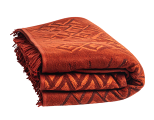 Folded, fringed terracotta towel w/ geometric patterns