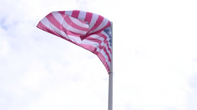 American Flag Blowing Over Overcast Sky