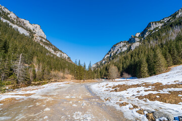 Icy path at Dolina Koscieliska valley in snow at beautiful Polish west Tatry mountains in winter