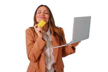 Happy woman enjoying online shopping, holding a laptop and credit card, experiencing retail therapy, transparent background