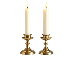 Twin candles burning in brass holders, centered