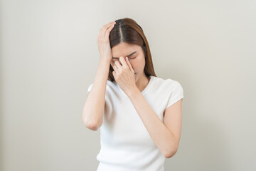 Dizzy asian young woman, girl headache or migraine pain suffering from vertigo or sick, holding head with hand, health problem of brain or inner ear not balance, standing isolated on white background.