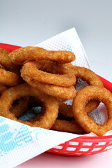 Close up of crunchy onion rings in a basket