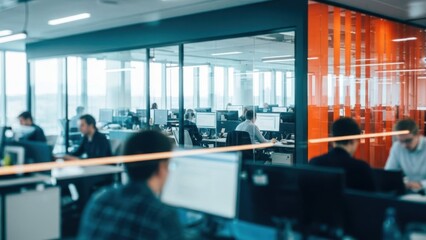 Modern office workers focused on tasks in bright open space