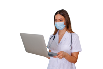 Female medical professional in face mask using laptop, demonstrating telehealth, online consultation, and digital healthcare