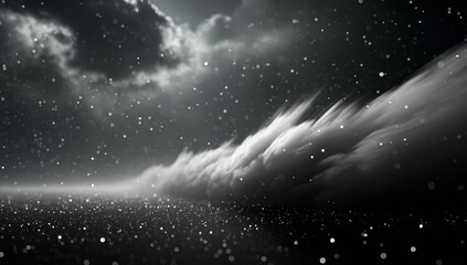 Dark sky with clouds and snow falling. The clouds are white and the snow is falling in a hazy, blurry manner