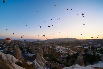 Sunrise at Cappadocia. Bright colorful balloons flying during sunrise in valley. Goreme, Nevsehir, Cappadocia