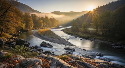Winding river flows through a valley surrounded by foliage bathed in bright morning sunlight