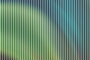 Obraz premium Vertical lines with color gradient: A striking composition of vertical lines, masterfully blending a spectrum of colors and hues, resulting in a mesmerizing display of visual art and design.