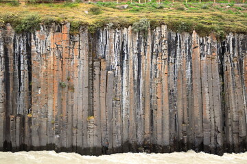 Majestic basalt columns structure over the river in Studlagil Canyon, Iceland