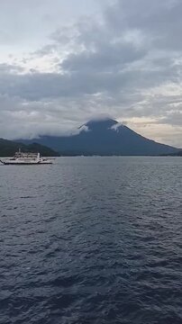 Scenic View of kie matubu Volcano and Maitara Island from a Ferry in North Maluku, Indonesia