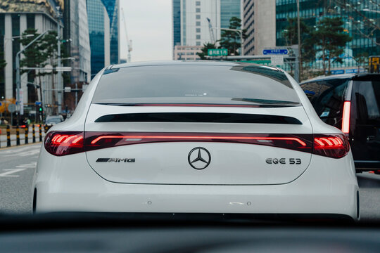 November 29, 2025, Seoul, South Korea - Rear view of a white Mercedes-AMG EQE 53 electric car in city traffic.