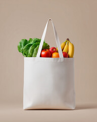 White reusable grocery bag filled with fresh vegetables and fruits isolated on light background, eco friendly shopping concept, sustainable lifestyle, healthy food, organic market and zero waste