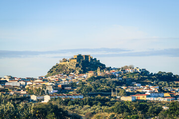 Obraz premium Montanchez hilltop castle over white village