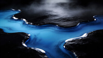 Abstract macro photo of vibrant blue viscous liquid forming winding rivers and wavy streams across a dark textured black surface with glossy reflections