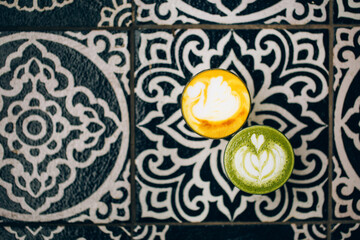 Trendy multicolored lattes. Avocado and turmeric tastes with latte art.