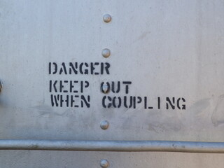 A sign stenciled onto a train car