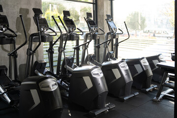 Five Elliptical Machines Side by Side in Gym
