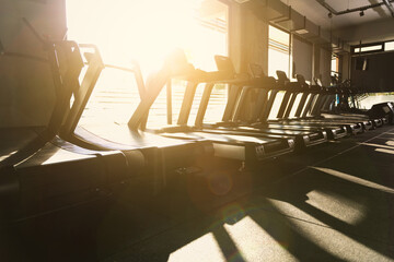 Sunset Backlit Treadmills in Gym Photo