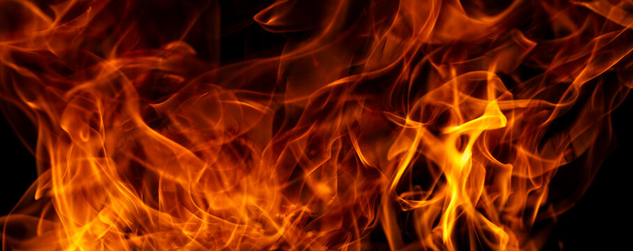 Intense burning fire texture for layered visual effects. Fire texture with realistic flame movement. Flames with a dramatic fire background. Fire abstract design with bold flame structure.