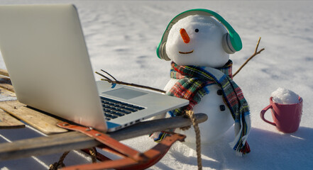 Snowman on snowy field for Christmas. Snow man in frost. Snowman in winter banner design. Snowman with icy winter backdrop. Snowman festive design for postcard.