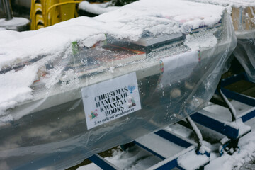 Book display during winter with holiday themed books for various celebrations