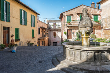 Italy - Sutri - Piazza Cavour Fountain - Octagonal Renaissance basin with sculpted finial in cobblestone square