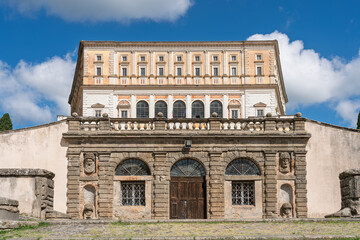 Italy - Caprarola - Palazzo Farnese - Detail of the historic Renaissance facade with rustication and upper loggia